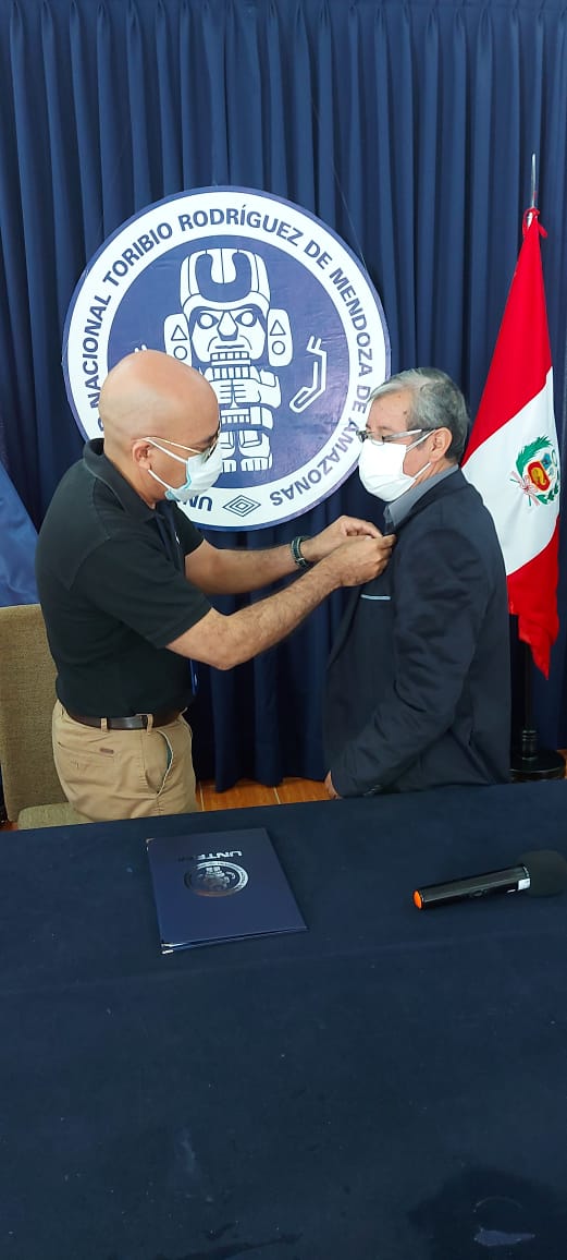 acto de entrega de pin