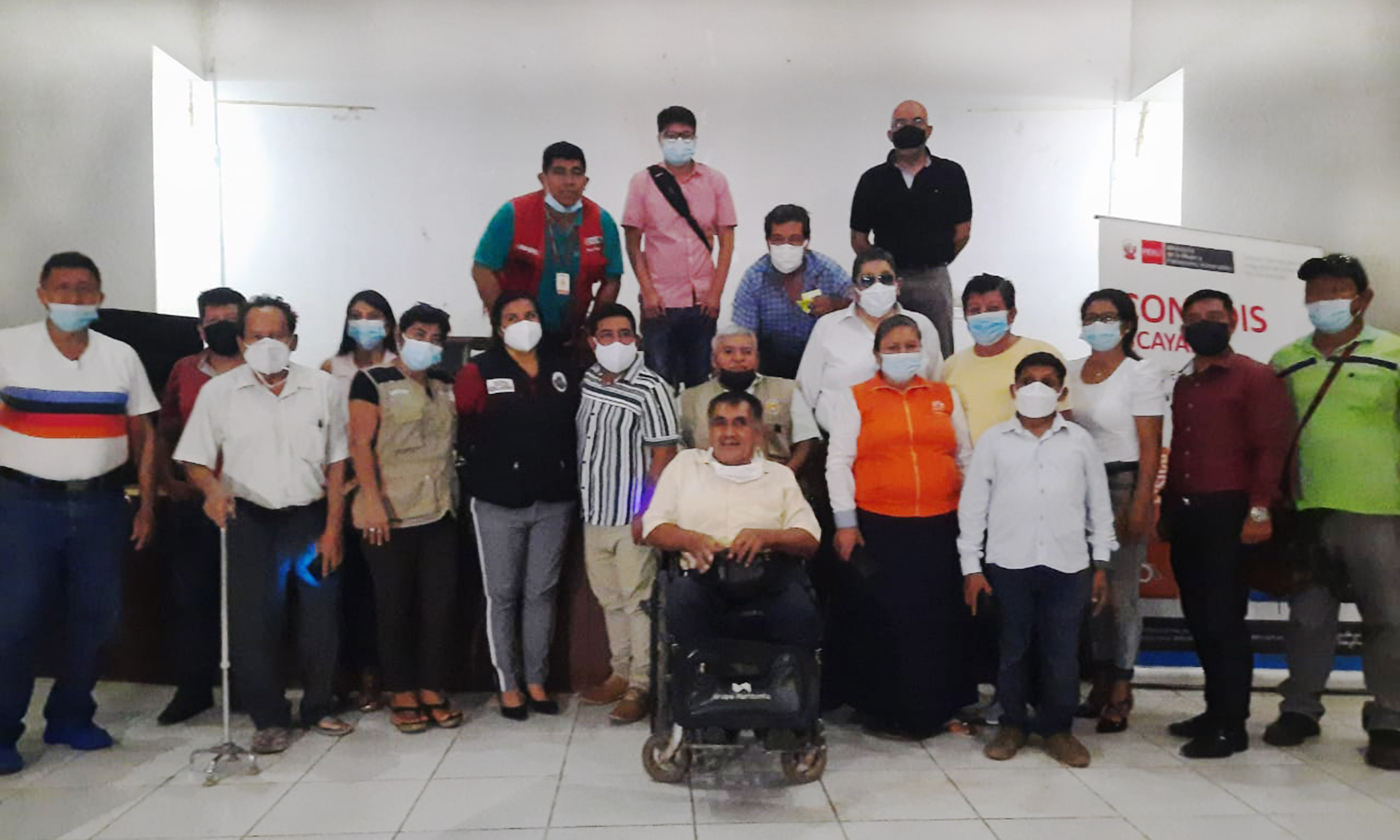 Imagen de un grupo de personas en un auditorio de Ucayali