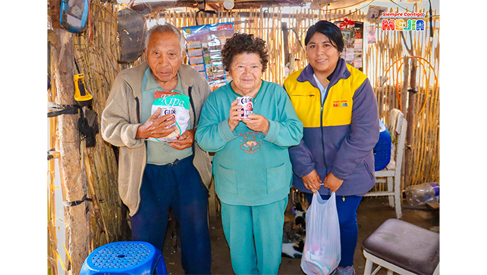Entrega de alimentos a los integrantes del Programa Vaso de Leche, correspondiente al mes de julio
