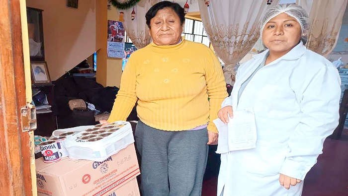 entrega de productos del programa del vaso de leche