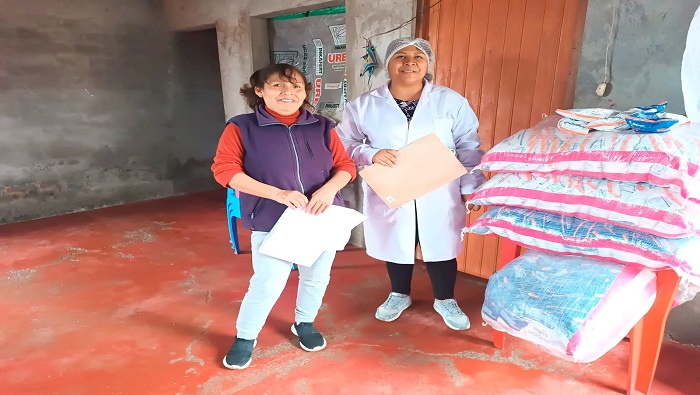 entrega de productos del programa del vaso de leche