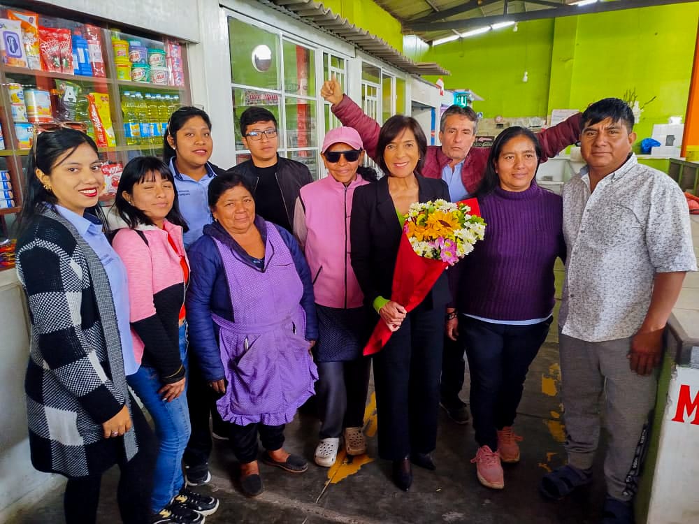 comerciantes de flores con alcaldesa